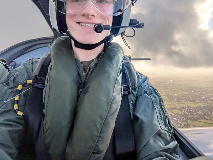 Cadet in a flight suit in an aircraft cockpit