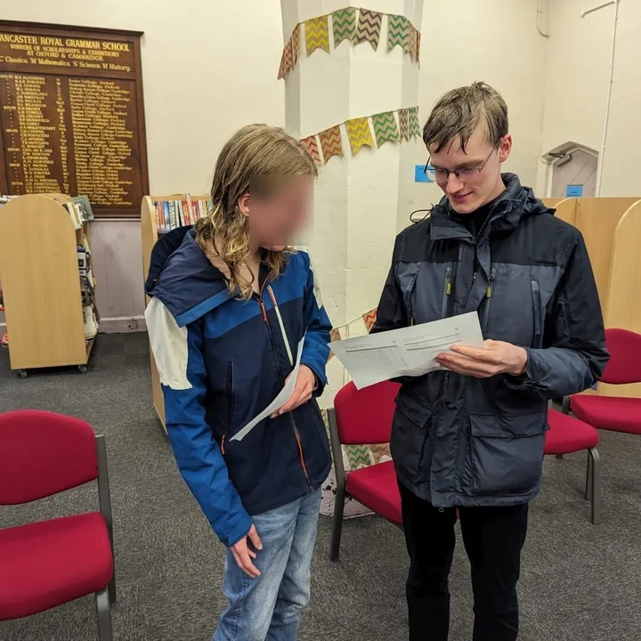 A student receiving a school award